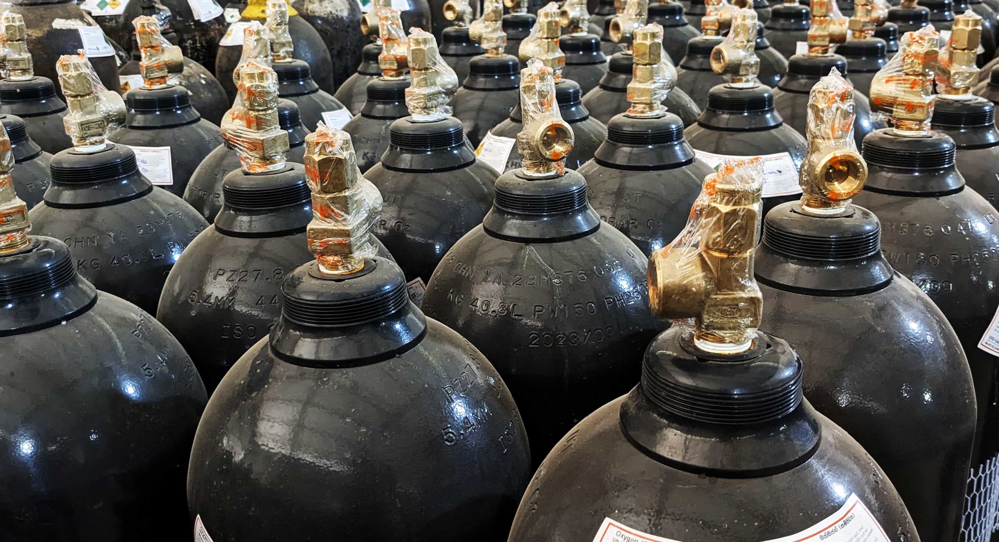 Variety of O & T Enterprises gas cylinders ready for supply, exemplifying excellence in gas equipment supply and maintenance.